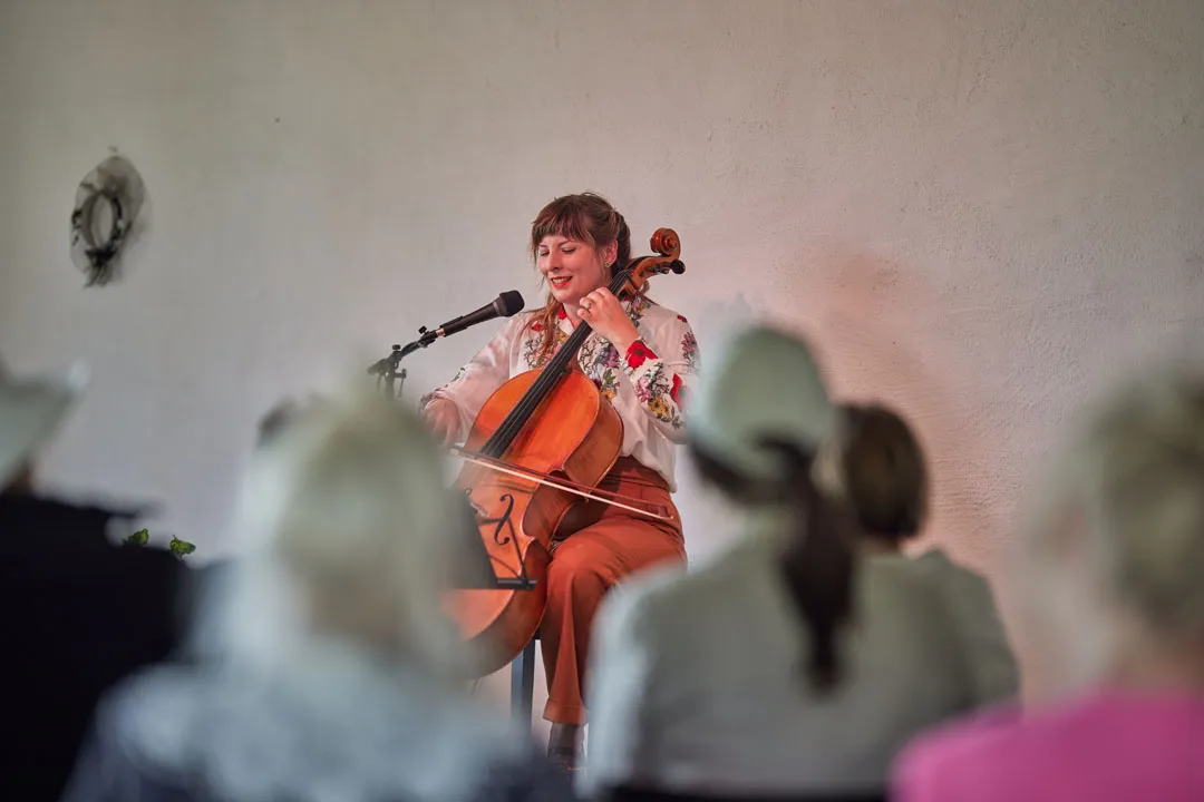 a woman playing a cello