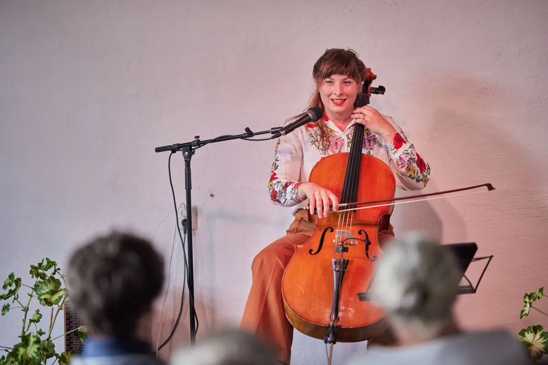 a woman playing a cello