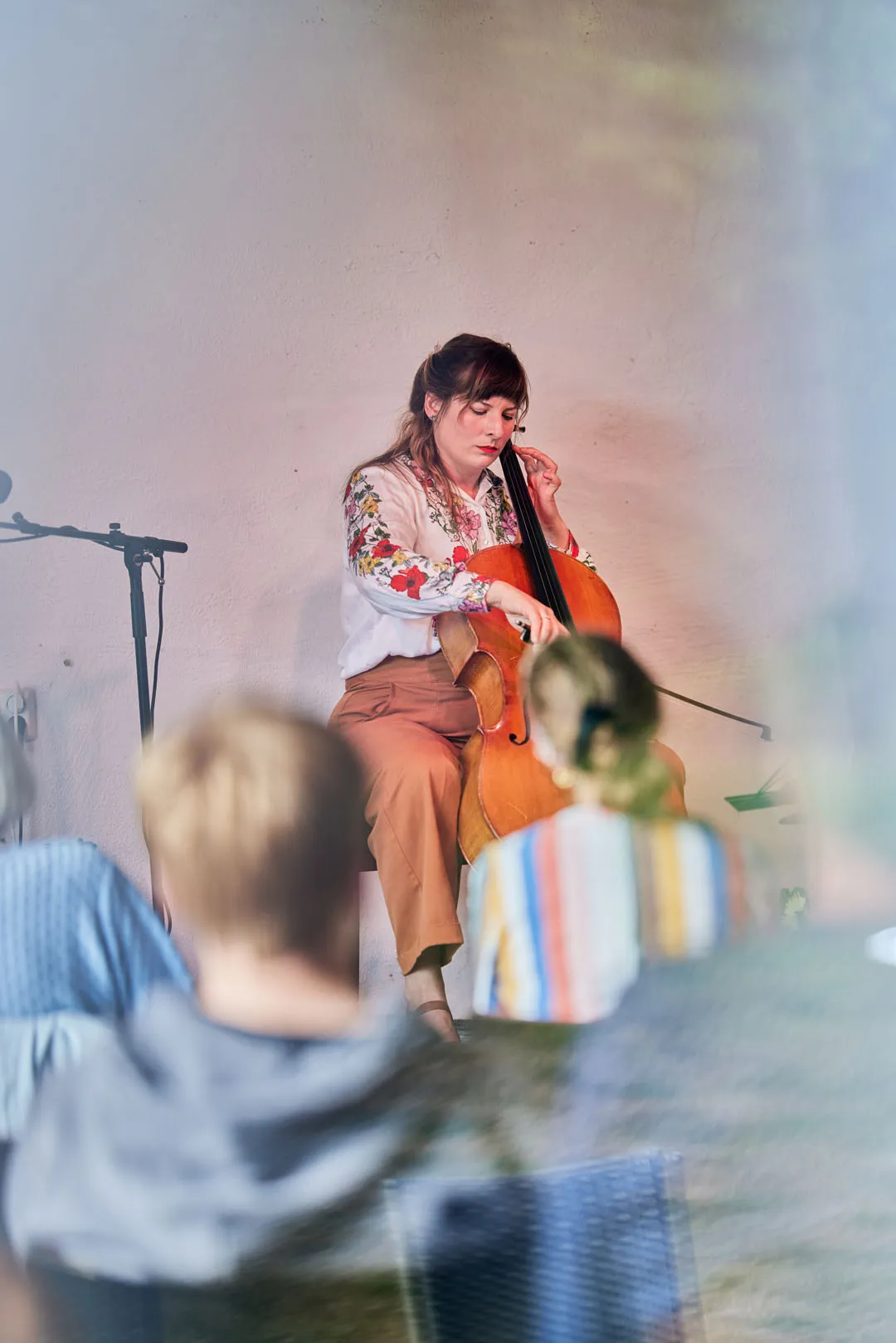 a woman playing a cello